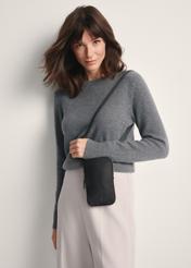 Black fabric women's bag TOREN-0331-99(Z25) - front view of the product on a model against a white background. Knee-length silhouette visible.