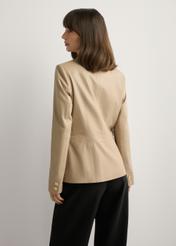 Beige women's leather jacket KURDS-0445-1B(W26), back view of the product on the model. Half of the silhouette visible.