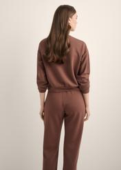Brown women's sweatshirt BLZDT-0119-1H(Z26), back view of the product on the model. Half of the silhouette visible.
