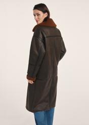 Long brown women's sheepskin coat KOZDP-0014-90(Z25) - product view from the back on a model on a white background. The entire silhouette is visible.