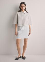 Cream denim mini skirt SPCDT-0126-0B(W26), front view of the product on the model. Full body visible.