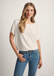 Women's white ribbed blouse BLUDT-0170-0B(W26), front view of the product on the model. Half of the silhouette visible.