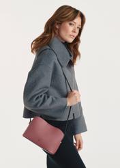 Small women's handbag in pink TOREC-0768 C-32(Z 25), front view of the product on the model, half of the silhouette visible.