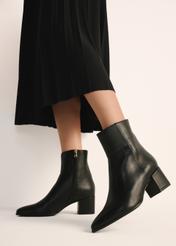 Women's leather ankle boots in black BUTYD-1186-99(Z25), product view on a model against a light background.