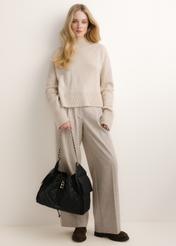 TORES-1365-9P(Z26) quilted leather women's handbag; front view of the product held in a model's hand.