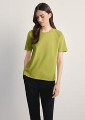 Women's lime green T-shirt TSHDT-0143-84(Z25), front view of the product on the model. Half of the silhouette visible.