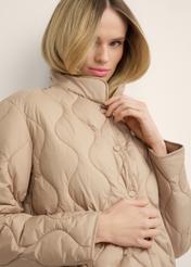 Women's short beige jacket KURDT-0689-1D(Z26), diagonal view of the product on the model. Half of the silhouette visible.