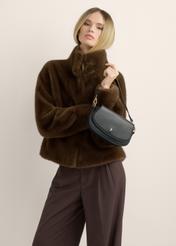 Small black women's handbag TOREC-1264-99(Z26), view of the product in the model's hand, on a light background.