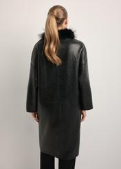 Black leather double-sided women's sheepskin coat KOZDS-0093-1396(Z25), back view of the product on the model. Half of the silhouette visible.