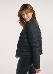 Quilted black women's jacket KURDT-0495-99(Z25), side view of the product on the model, half of the silhouette visible.