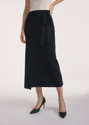 Black midi skirt SPCDT-0114-99(Z25), front view of the product on the model, half of the silhouette visible.