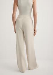 Beige women's wide leg trousers SPODT-0121-1A(W26), back view of the product on the model. Half of the silhouette visible.