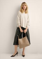 Large women's shoulder bag in cool beige TOREC-1337-1K(Z26), view of the product in the model's hands. Full body visible.