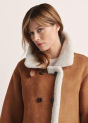 Women's sheepskin coat in camel color KOZDP-0013-24(Z25) - front view of the product on a model on a white background. Half of the silhouette visible.