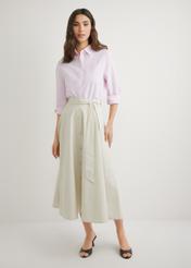 Beige midi skirt SPCDT-0123-1A(W26), front product view on model. Full body visible.