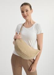 Beige semicircular women's handbag TOREN-0316-81(W25), front view of the product on a model. Half of the silhouette visible.