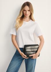 Women's handbag with croco elements TOREC-0860A-97(Z25), front view of the product on a model, half of the silhouette visible.
