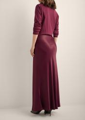 Burgundy long women's skirt SPCDT-0117-4D(Z26), product view from the back on the model. Half of the silhouette visible.