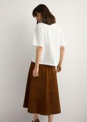 Women's white T-shirt with print TSHDT-0153-0B(W26), back view of the product on the model. Half of the silhouette visible.