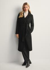 Black long women's coat PLADT-0048B-99(Z25), front view of the product on the model, the entire silhouette is visible.