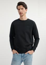 Black men's sweatshirt without hood BLZMT-0070-99(W25) - front view on the model on a white background. Half of the silhouette visible.