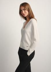 Cream women's cardigan KARDT-0061-0P(W26), side view of the product on the model. Half of the silhouette visible.