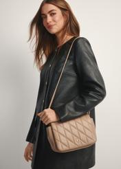 Beige women's handbag with stitching TOREC-1151-1D(W26), front view of the product on a model, half of the silhouette visible.