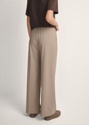 Women's dark beige trousers SPODT-0119-1K(W26), back view of the product on the model. Half of the silhouette visible.
