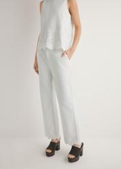 Women's white wide leg trousers SPODT-0122-0B(W26), front view of the product on the model. Half of the silhouette visible.