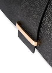Women's leather handbag in black color TORES-1220-9I(W26) - close-up of detail, on white background.