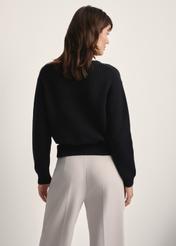 Black women's sweater SWEDT-0238-99(Z25), back view of the product on the model. Half of the silhouette visible.