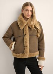 Women's brown short sheepskin coat KOZDP-0017-1H(Z26), front view of the product on the model. Half of the silhouette visible.