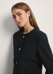 Black short women's jacket ZAKDT-0041-99(W26), close-up of the product from the front on the model's silhouette.