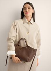 Brown women's shoulder bag TOREC-1231-1H(Z26), front view of the product on a model, half of the silhouette visible.