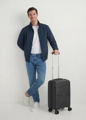 Small suitcase on wheels WALPP-0021-99-19(W25), product view diagonally next to the model, the entire model is visible.