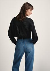 Women's black shirt with animal print KOSDT-0174-51(Z25), back view of the product on the model. Half of the silhouette visible.