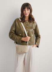 Small beige women's handbag TOREC-0882-1B(W26), product view on model's shoulder. Half of silhouette visible.