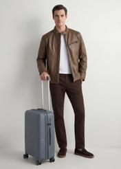 Small suitcase on wheels WALPP-0021-9B-19(W26), diagonal view of the product next to the model's silhouette.