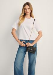 Small black leather women's handbag TORES-1044-99(Z25), front view of the product on a model, half of the silhouette visible.
