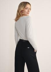 Beige women's blouse with long sleeves LSLDT-0038-81(KS), product view from the back on the model, half of the silhouette visible.