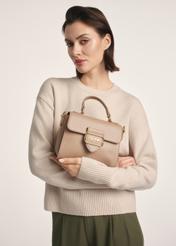 Beige small women's shoulder bag TOREC-0962A-81(Z25), product view in model's hands. Half of silhouette visible.