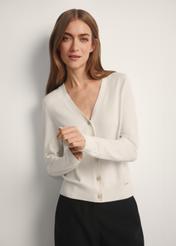 Cream women's cardigan KARDT-0061-0P(W26), front view of the product on the model. Half of the silhouette visible.