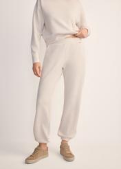 Light beige women's trousers SPODT-0117-80(Z25), front view of the product on the model. Half of the silhouette visible.