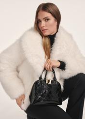 Black women's glossy handbag TOREC-1110-99(Z25) - front view of the product on a model against a white background. Half of the silhouette visible.