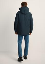 Men's longer jacket with hood KURMT-0253-69(Z25) product view, from the back on the model, the whole silhouette is visible.