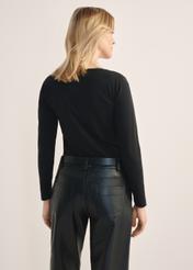 Black women's blouse with long sleeves LSLDT-0038-99(KS), product view from the back on the model, half of the silhouette visible.
