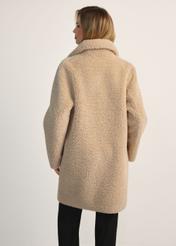 Women's fur coat with double-breasted fastening FUTDP-0018-81(Z25), product view from the back on the model, half of the silhouette visible.
