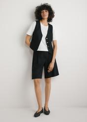 Black viscose and linen vest KAMDT-0038-99(W26) - front view of the product, on a model, on a light background, the whole silhouette is visible.