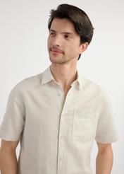 Beige men's shirt with short sleeves KOSMT-0327-81(W25) - close-up of the front on the model on a white background. Half of the silhouette visible.
