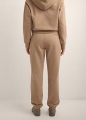 Women's camel trousers SPODT-0129-1D(Z26), product view from the back on the model. Half of the silhouette visible.